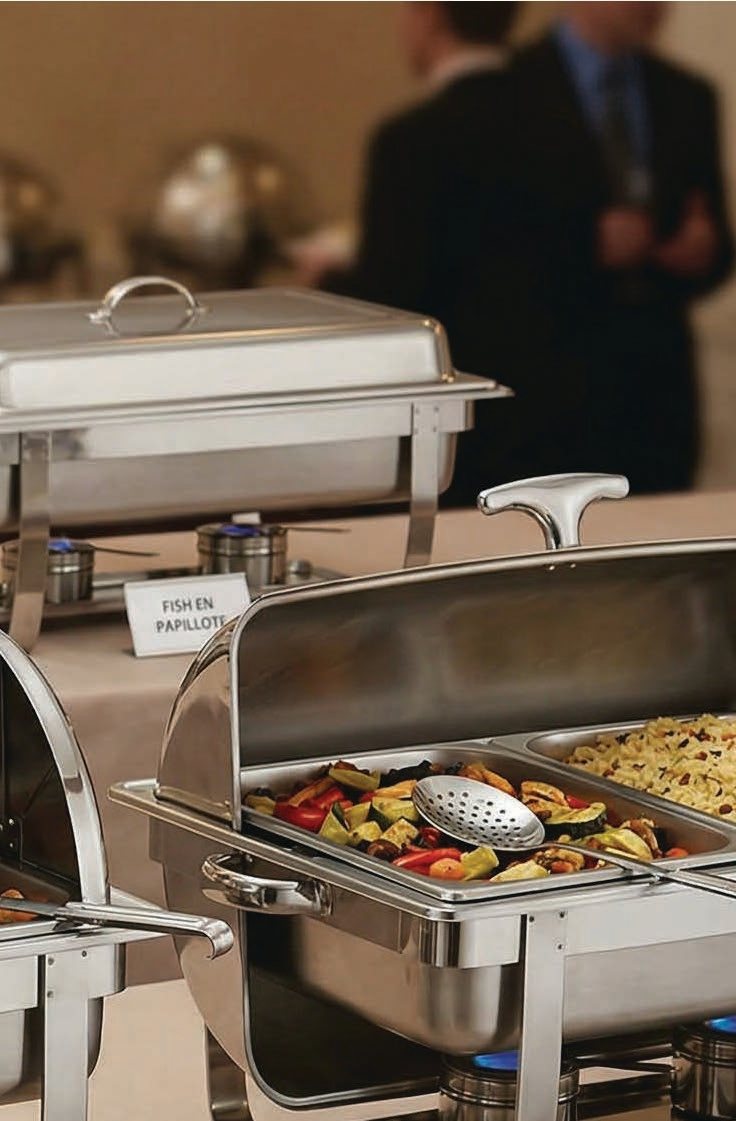 Catering buffet service with chafing dishes and prepared dishes